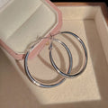 Large C-Shaped Hoop Earrings on a clean product background
